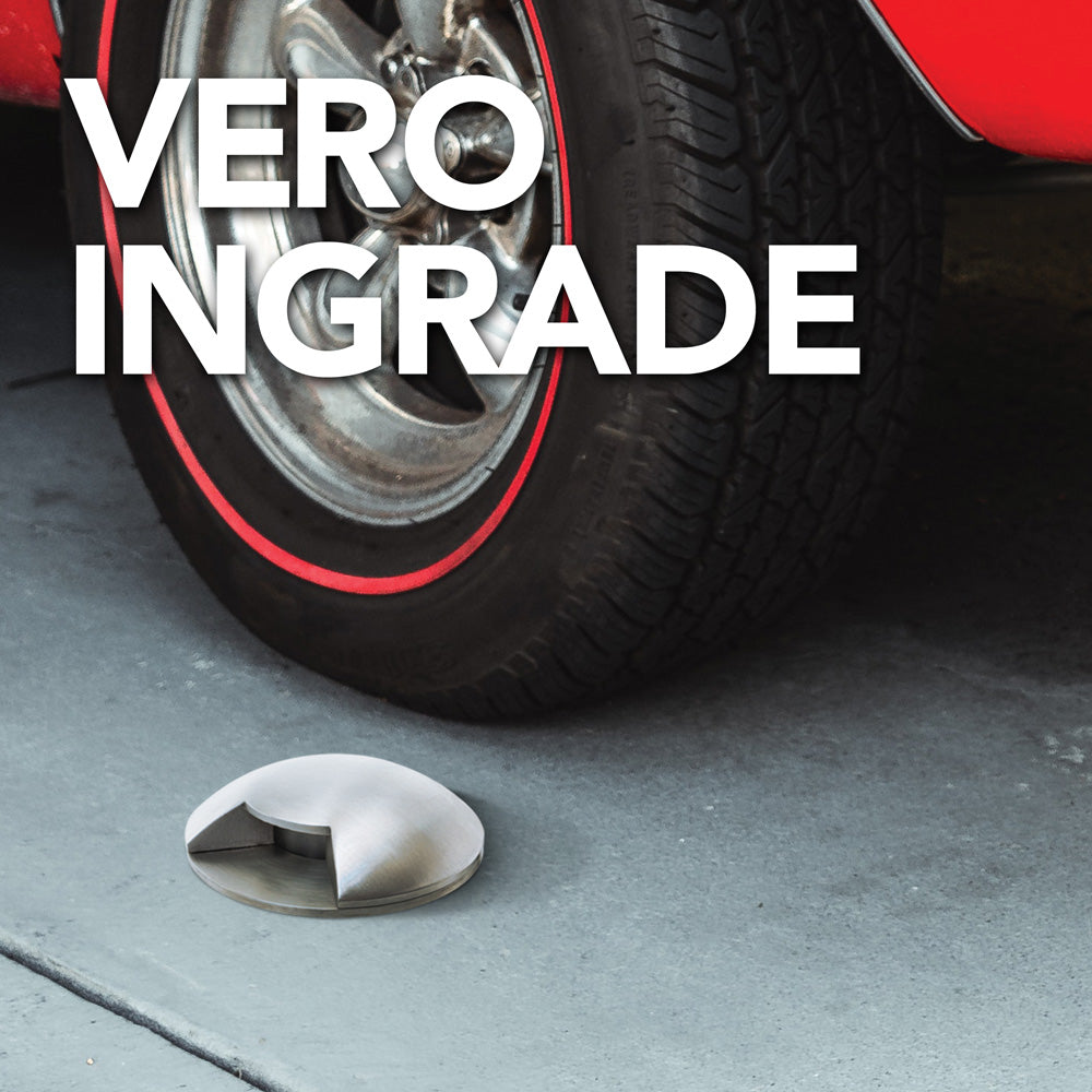 VeroIngrade lighting fixture near a classic car tire, designed for outdoor ambiance and energy efficiency.