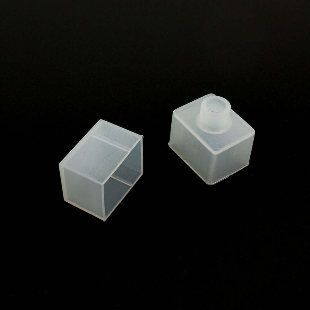 Transparent silicone caps for containers, showcasing a square and rectangular design on a black background.