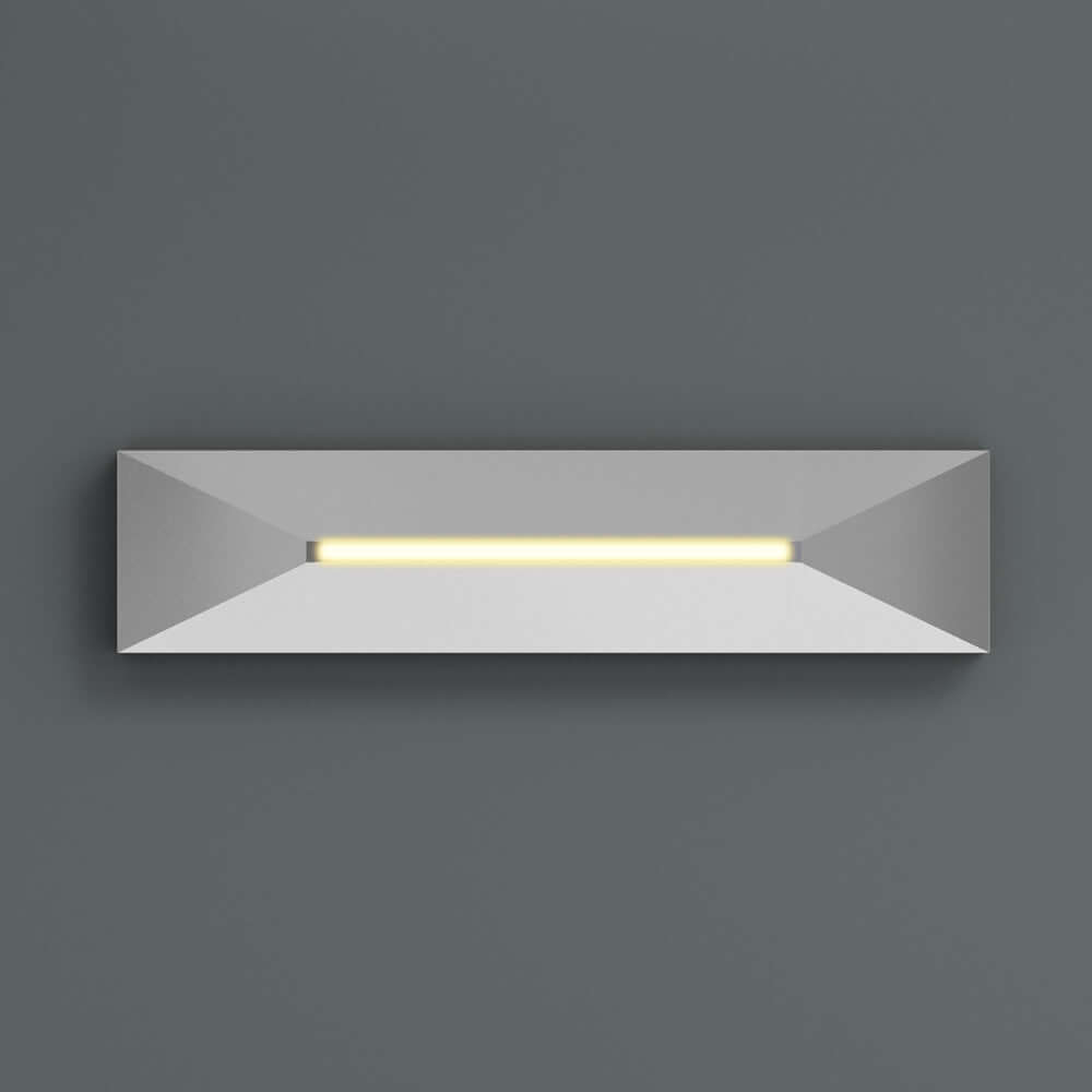VBD-COB-24V-100L-xxxx-STP4-Silver 4-inch step light with soft white LED illumination on grey wall.