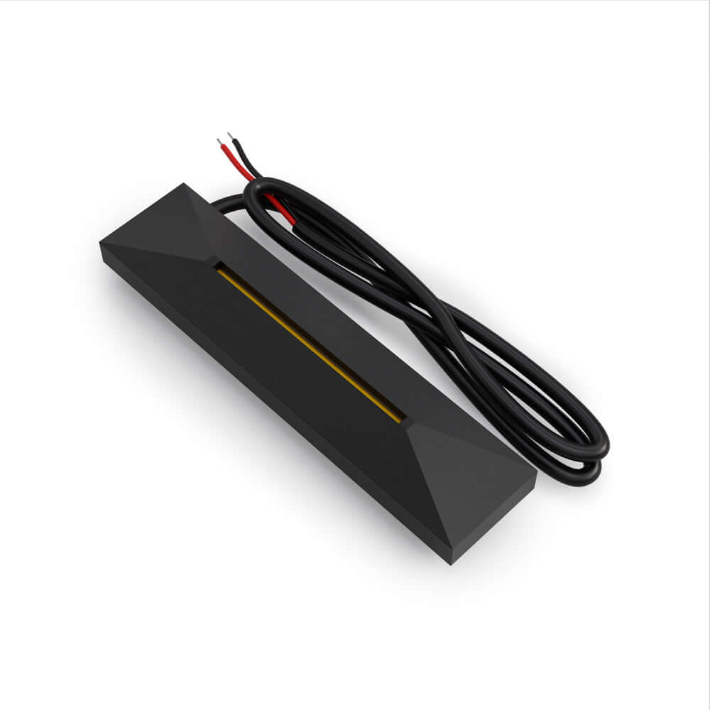 Black 4-inch step light with two wires for 24V installation, ideal for indoor and outdoor lighting.