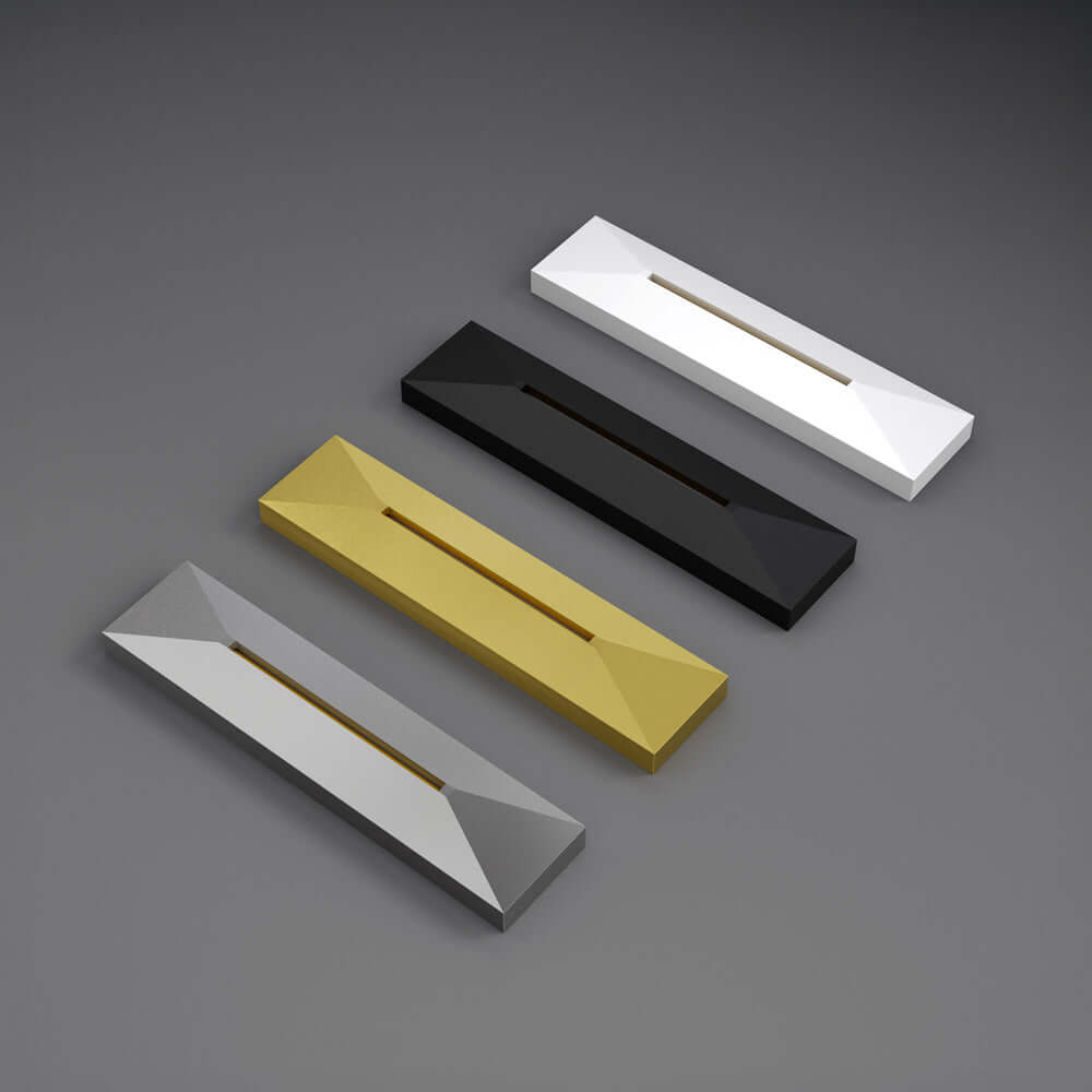 Four geometric step lights in white, black, gold, and silver finishes on a dark background.