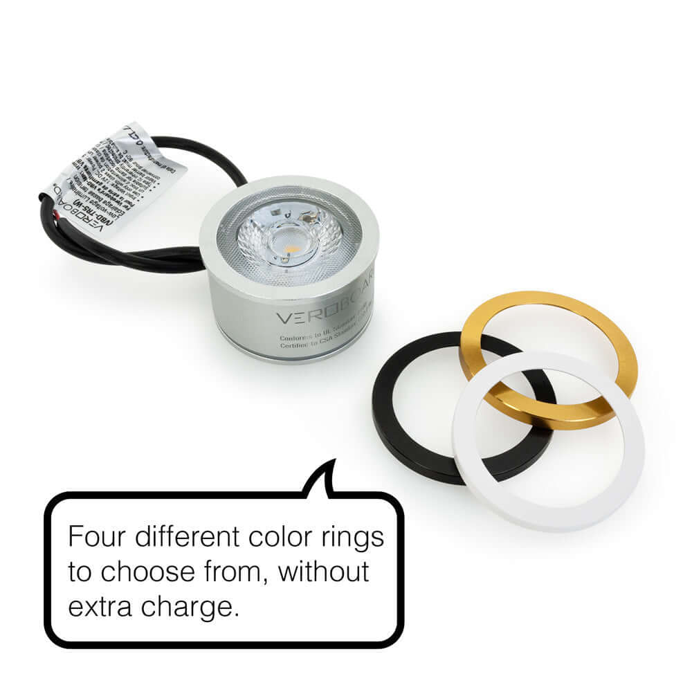 VBD-TR5-W-40K LED Light Engine with silver body and four interchangeable color rings: black, white, gold, and silver.